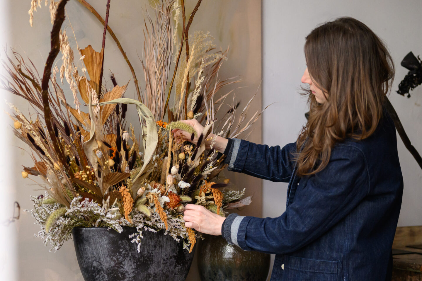 Florentia Village florist tenant arranging flowers.